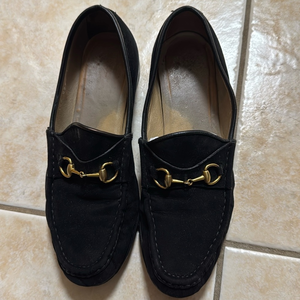 Gucci black suede horse block loafers.